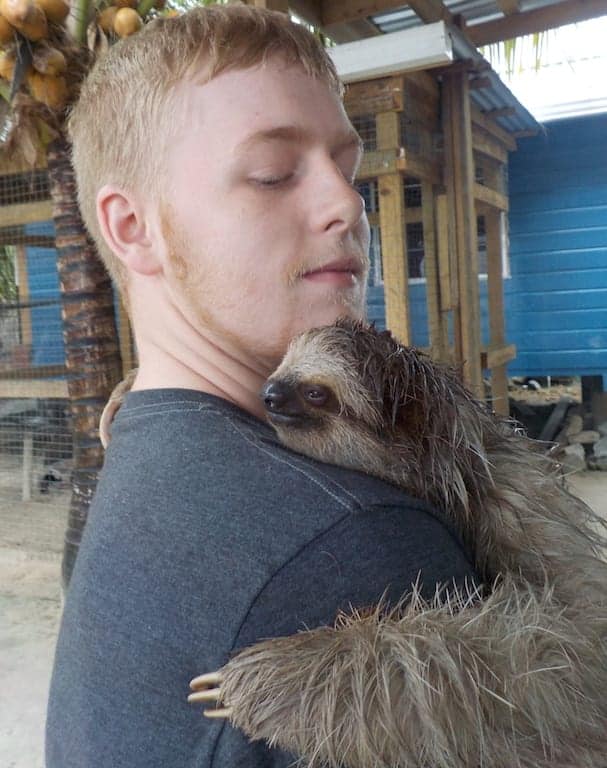 Sloths and Monkeys: The Best Mahogony Bay Excursion 6 Hold a sloth in Roatan