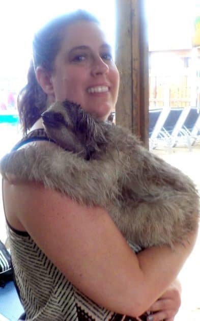 15 Romantic Travel Bucket List Locations for Couples 4 Hold a sloth in Roatan