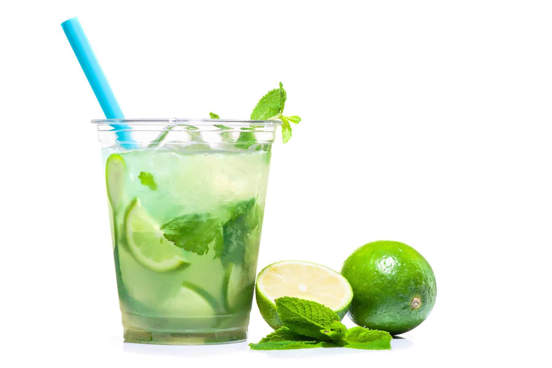 Essential Oil Blends that smell like a Disney Vacation 6 cup on a light background. Lime near the plastic cup