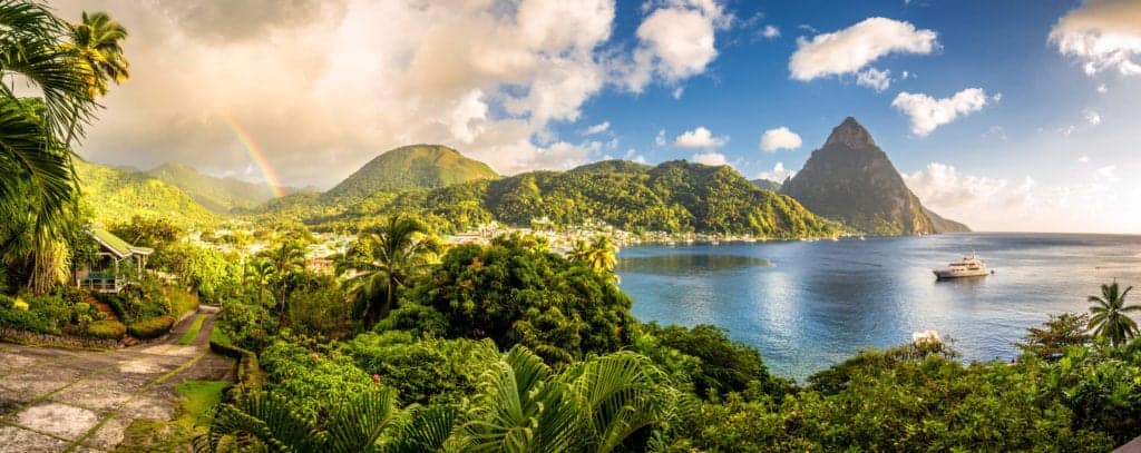 Scenic view of Pitons in St Lucia with majestic mountains and crystal blue ocean.