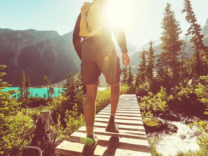 Early bird hiker catching a stunning sunrise on the mountain trail. Nature's morning masterpiece!