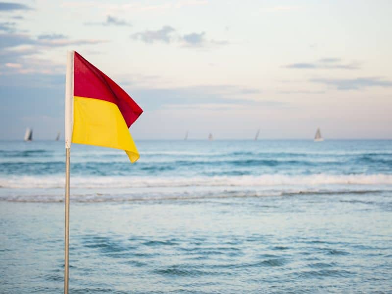 Pop Quiz: Do You Know What These Beach Flags Mean? 10 red and yellow beach flag means lifeguard
