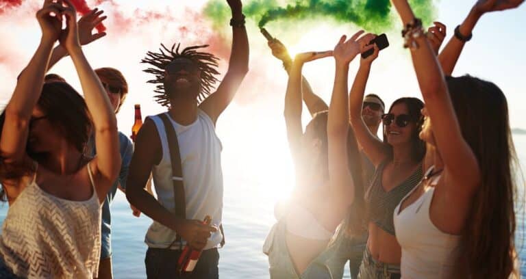 group of people drinking and dancing
