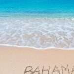 Beach with Bahamas written in sand
