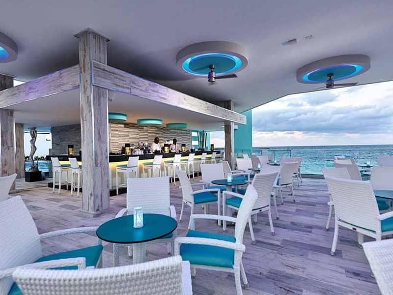 a sophisticated and inviting interior of the RIU Palace Nassau, featuring a well-appointed dining area.