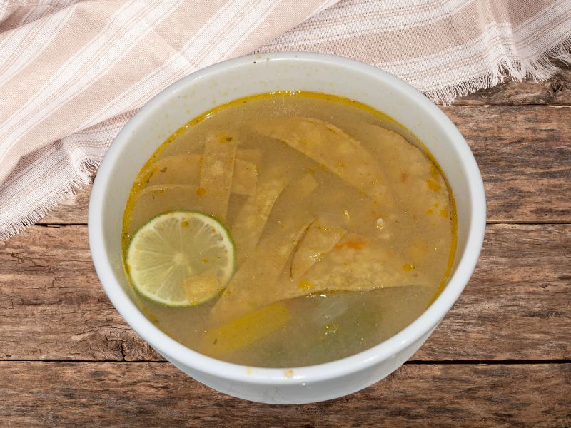 Sopa de Lima on a wooden table