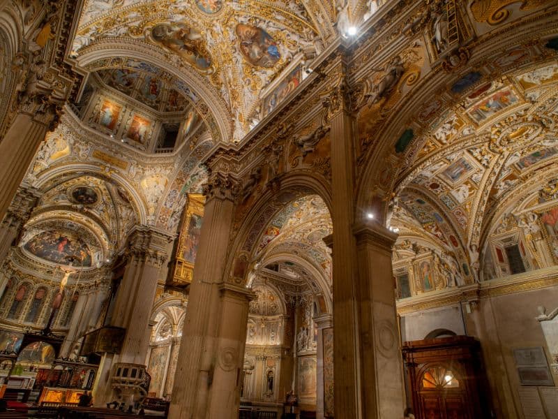 30 Famous Rome Italy Landmarks That You Must See 12 Look up and immersed in a celestial panorama, with celestial figures, angels, and ornate architectural details seamlessly blending together, creating a celestial masterpiece that adds to the overall grandeur and spiritual ambiance of the basilica.