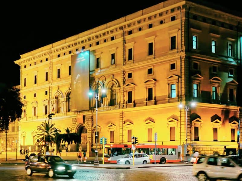 30 Famous Rome Italy Landmarks That You Must See 25 The Vibrant National Roman Museum at night with car passing by.