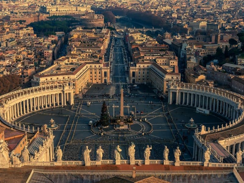 Vatican City, the spiritual heart of Catholicism, home to St. Peter's Basilica and the iconic Vatican Museums, with the dome of St. Peter's rising above the historic cityscape.