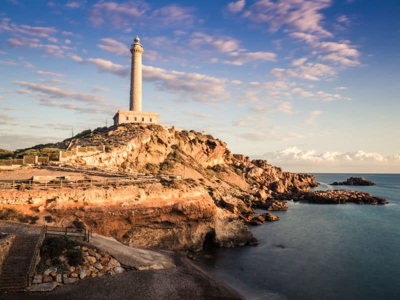 Iconic Cabo de Palos lighthouse standing tall against the backdrop of the beautiful Mediterranean Sea!