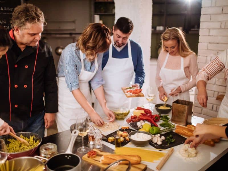 Civitavecchia Cruise Port Guide: Everything You Need to Know 10 Enthusiastic group learning to cook pizza and pasta in a Piazza Navona cooking class in Rome.