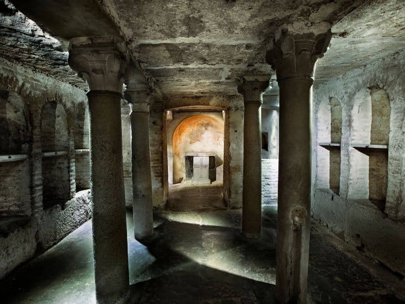 Civitavecchia Cruise Port Guide: Everything You Need to Know 6 Interior of ancient crypts and Roman catacombs with intricate stone carvings.