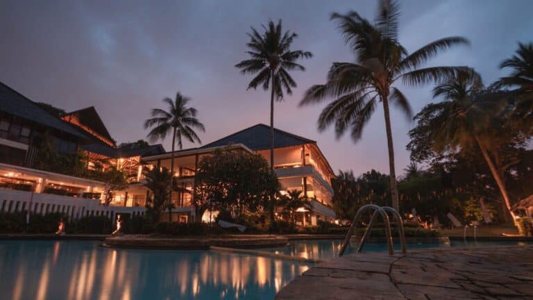 Palm Trees and Luxurious hotel at night