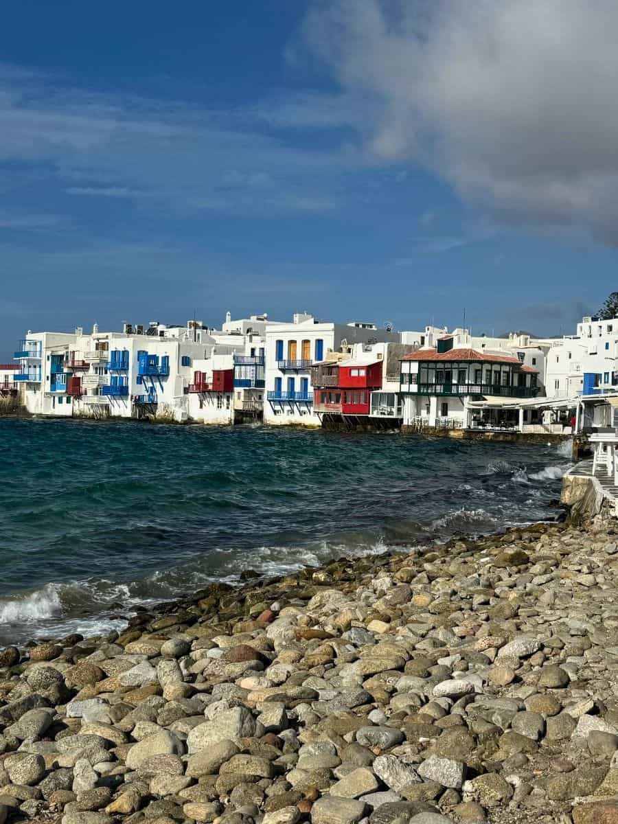 Explore Little Venice in Mykonos, Greece, through our Mykonos Cruise Port Guide. This charming area, with its colorful buildings perched on the water's edge, offers a picturesque and romantic setting, enhancing your cruise experience.