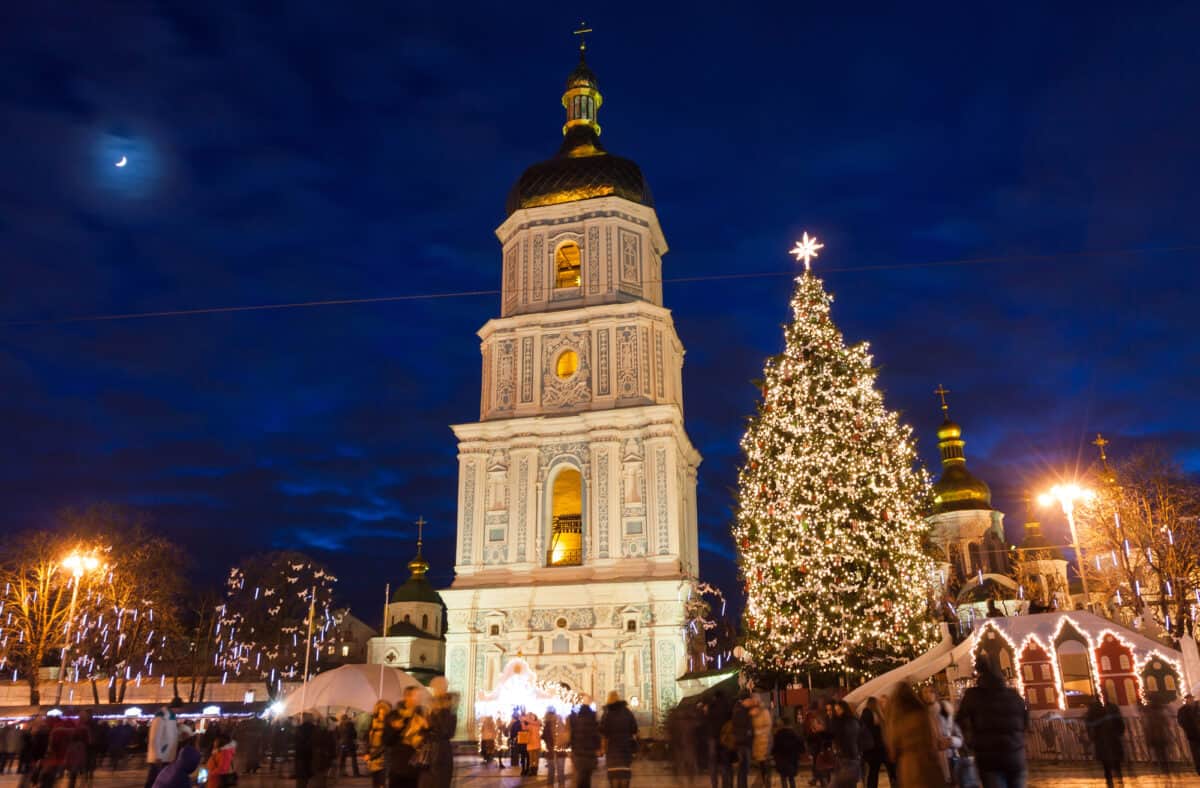 Christmas market on Sophia Square in Kyiv, Ukraine. Main Kyiv's New Year tree and Saint Sophia Cathedral on the background