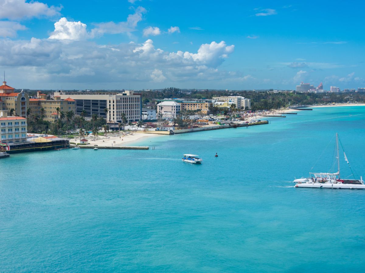 Bahamas In Winter: Everything You Need To Know 11 erial view of downtown Nassau, Providence Island, Bahamas, showcasing bustling streets, colorful buildings, and the surrounding turquoise ocean waters.