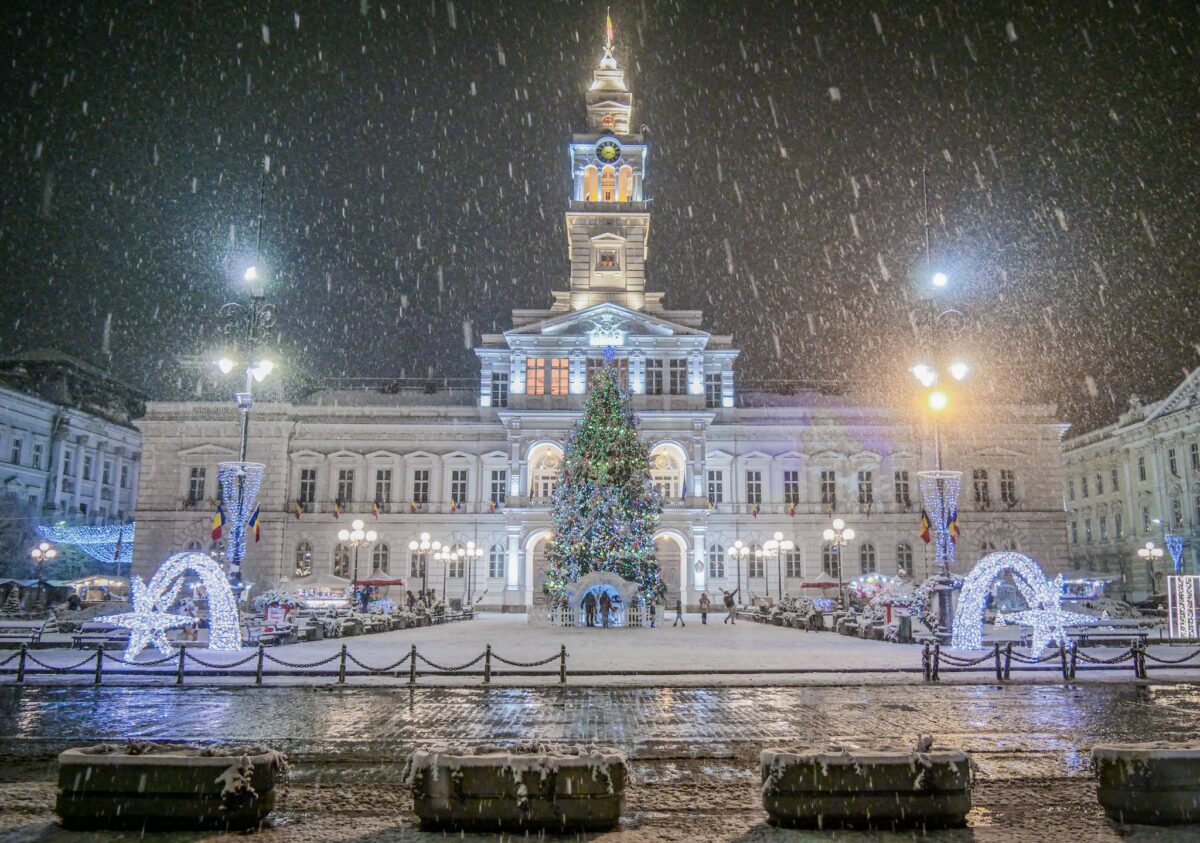 Frontage of Arad City Hall with Christmas Decorations on a Snowy Night 