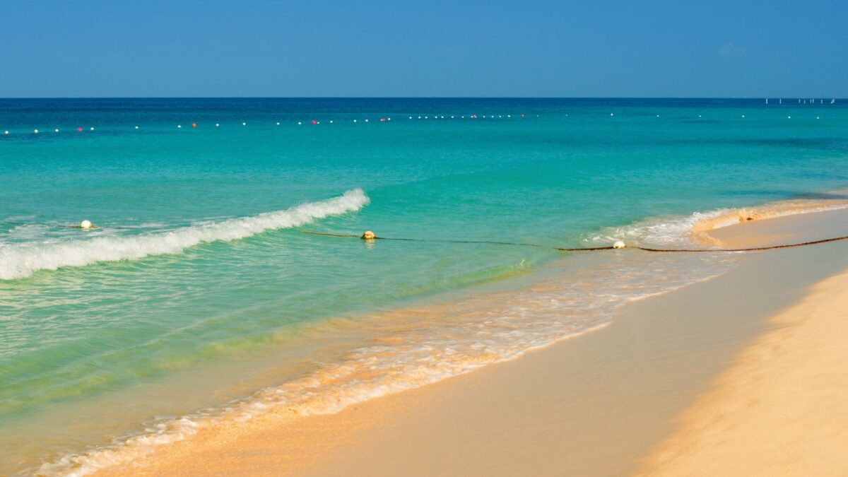 The Best Barbados Beaches Near Cruise Port To Explore 5 Pebbles Beach in Barbados, characterized by its crystal blue waters and golden sand, offering a picturesque and tranquil seaside retreat