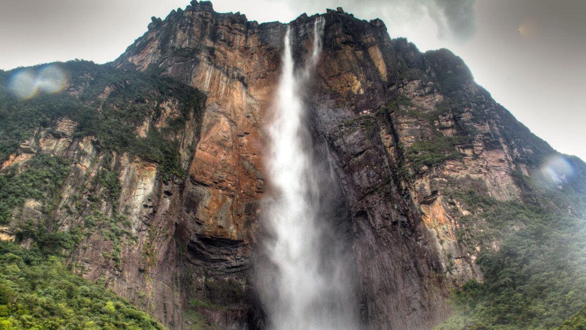 Discover the Real-Life Locations Behind Your Favorite Disney Films! 13 Angel Falls in Venezuela - tall waterfalls in the middle of a mountain.
