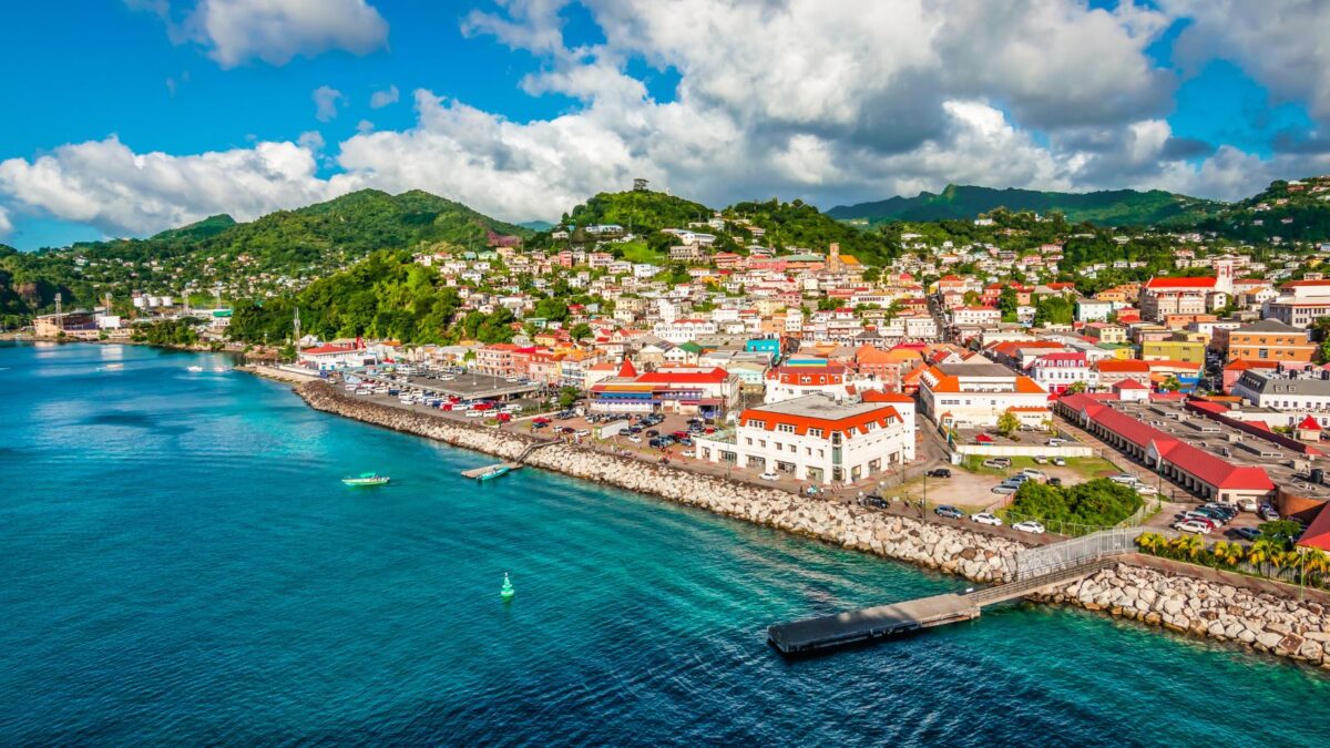 the vibrant town of St George's, Grenada, Caribbean on the coast of the sea with green mountains in the background