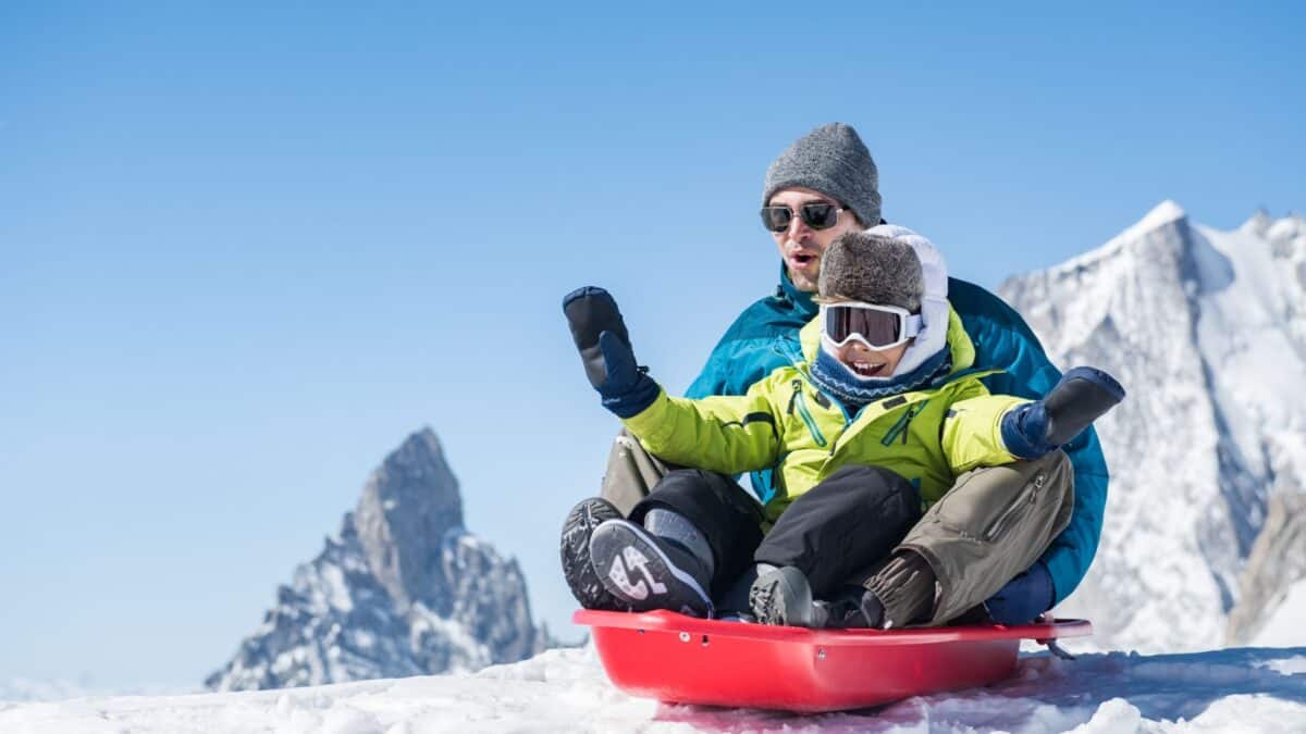 23 Reasons We Love Banff In The Winter 11 A dad and his child bobsledding.