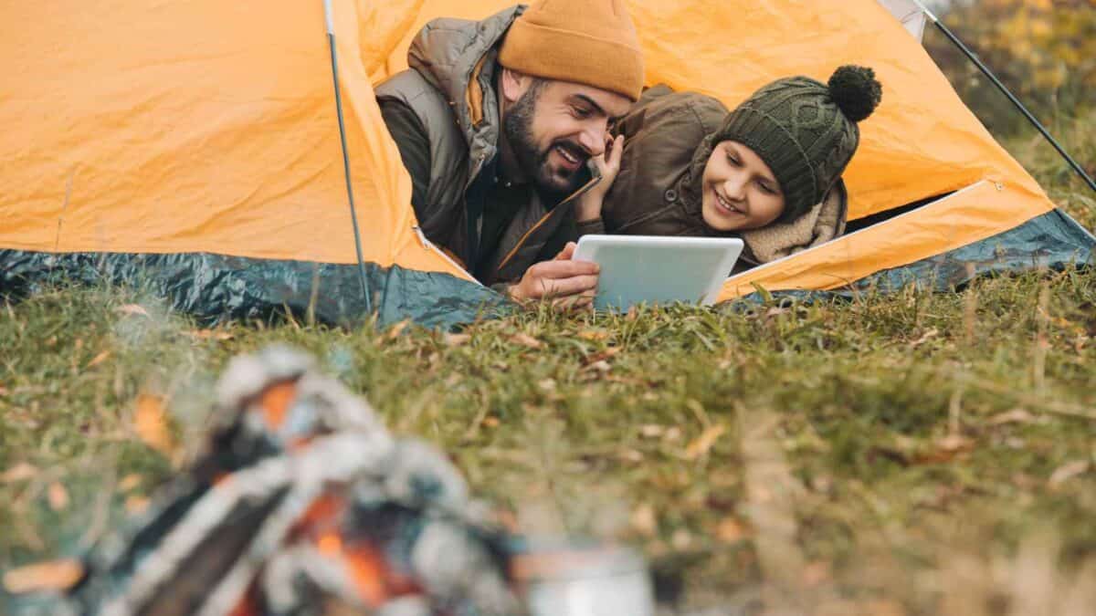 Couples reading books while Camping and Connecting with Nature 