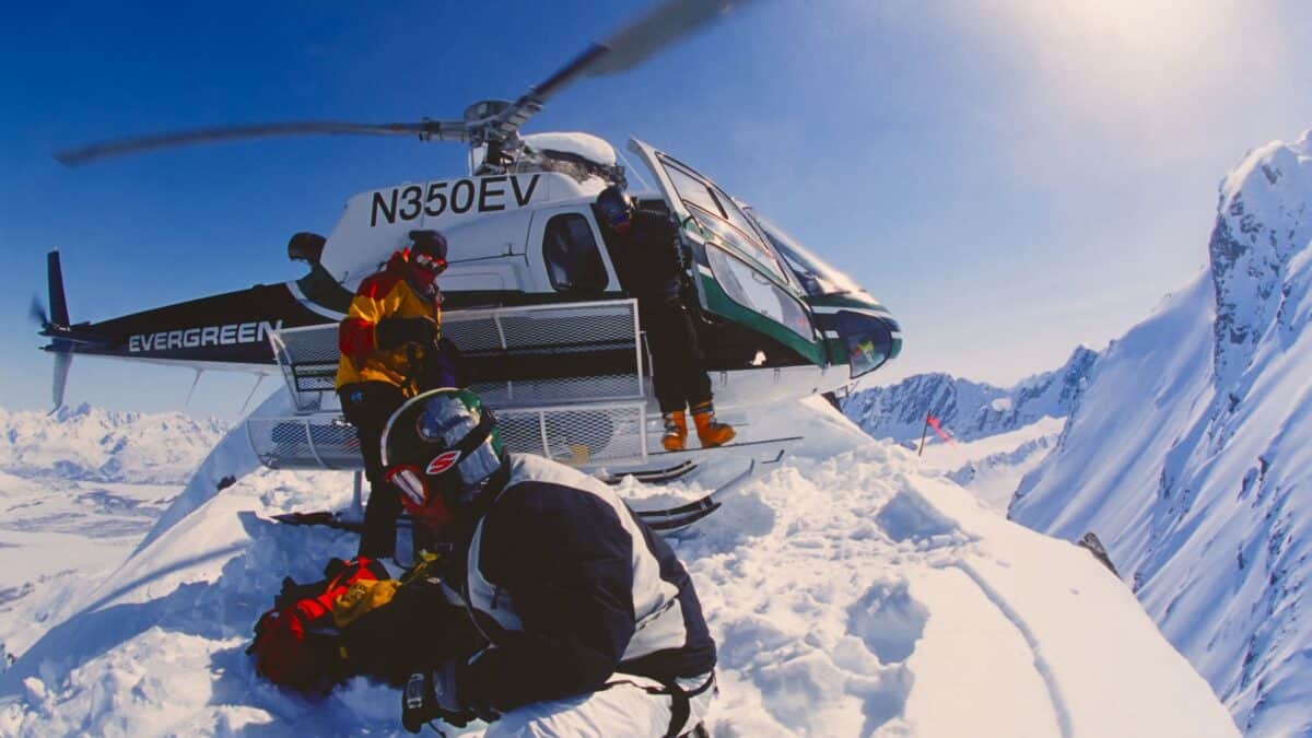 23 Reasons We Love Banff In The Winter 27 A group of people coming out from a helicopter skiing.