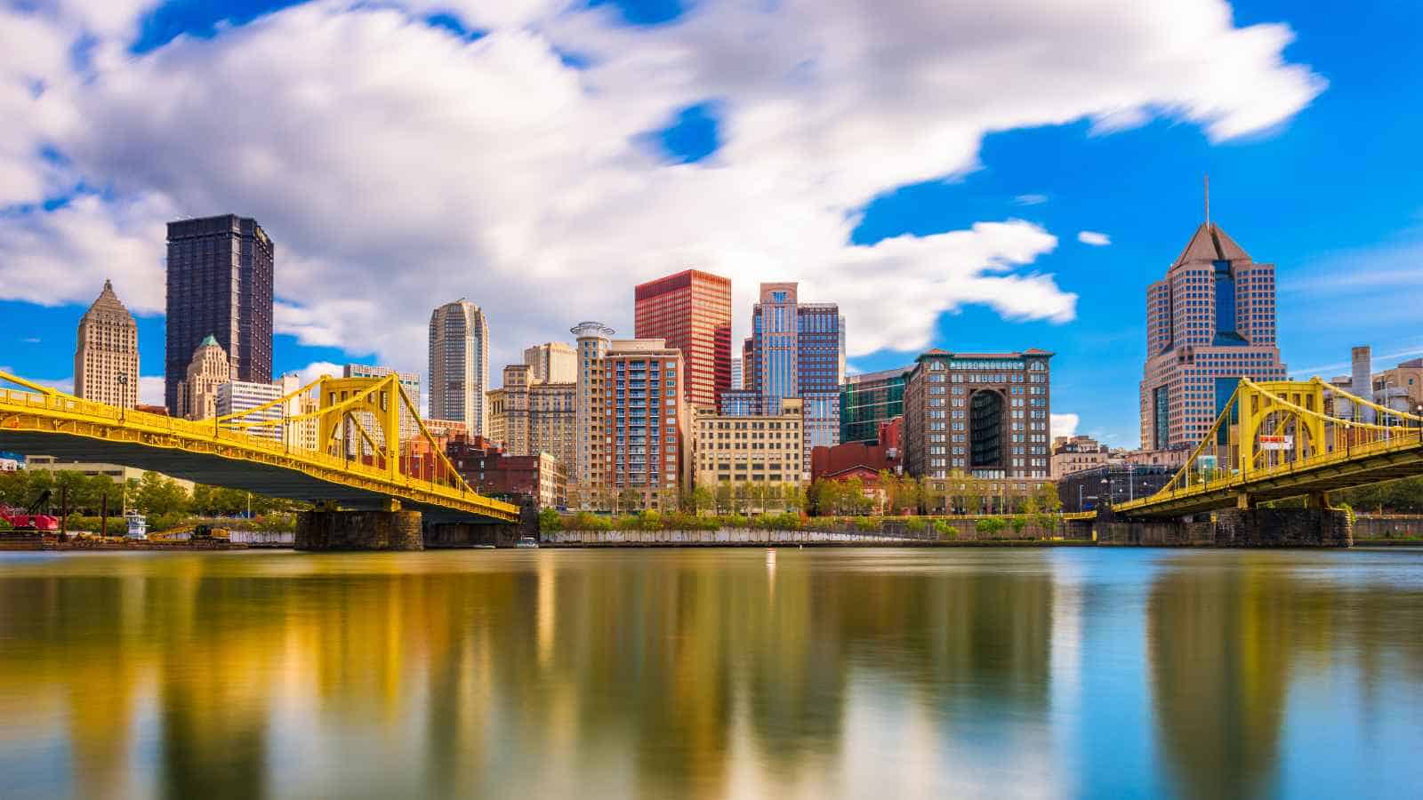 A panoramic view of a city skyline, hinting at underlying issues of major U.S. cities on the edge of bankruptcy, featuring modern skyscrapers and three yellow bridges over a reflective river under a