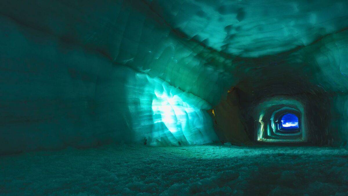 nside the illuminated blue ice tunnel of Langjökull Glacier in Iceland.