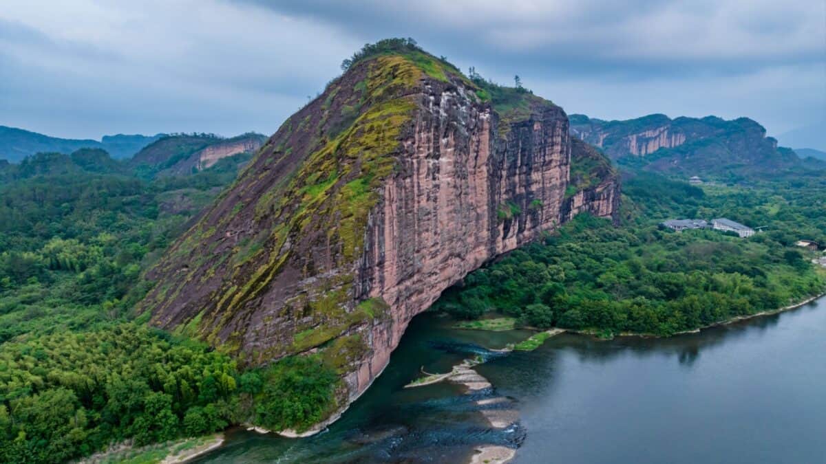 16 Survivor Locations that Would Actually Make Super Cool Vacation Destinations 12 Longhu Mountain in China on a cloudy day.
