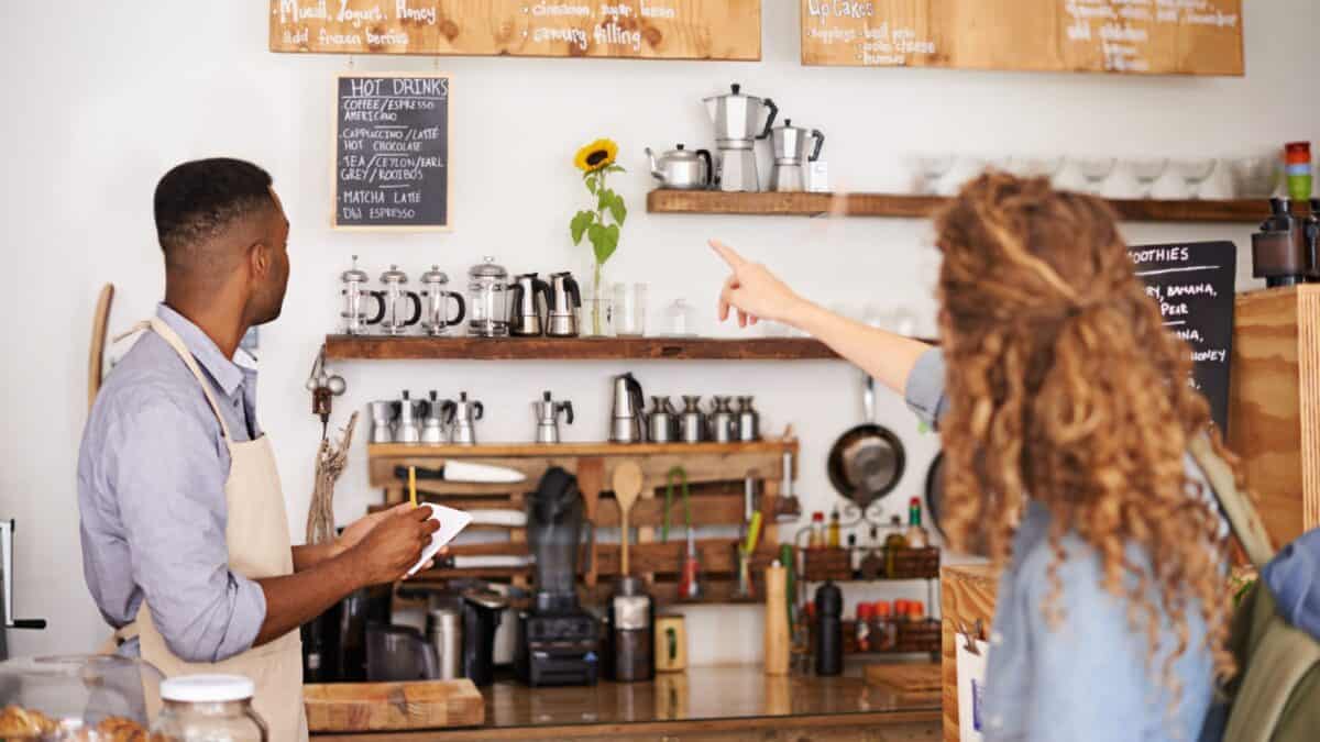 A woman ordering from a bakeshop.