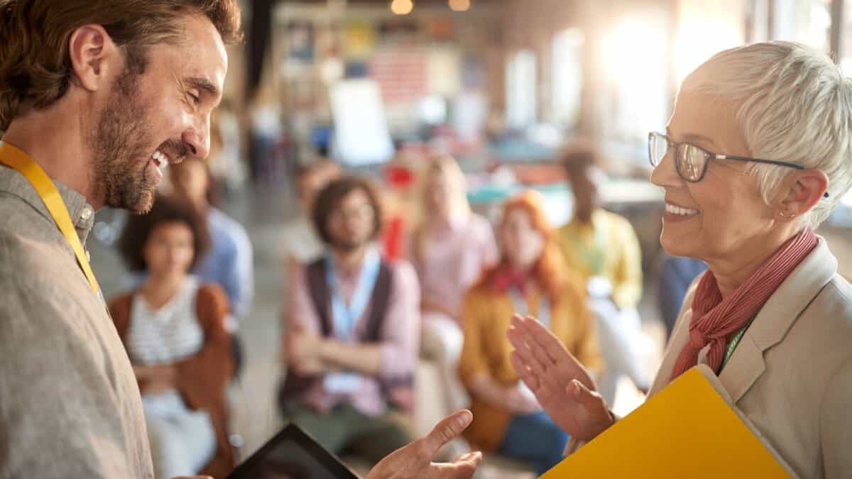 A speaker talking to one of her guests.
